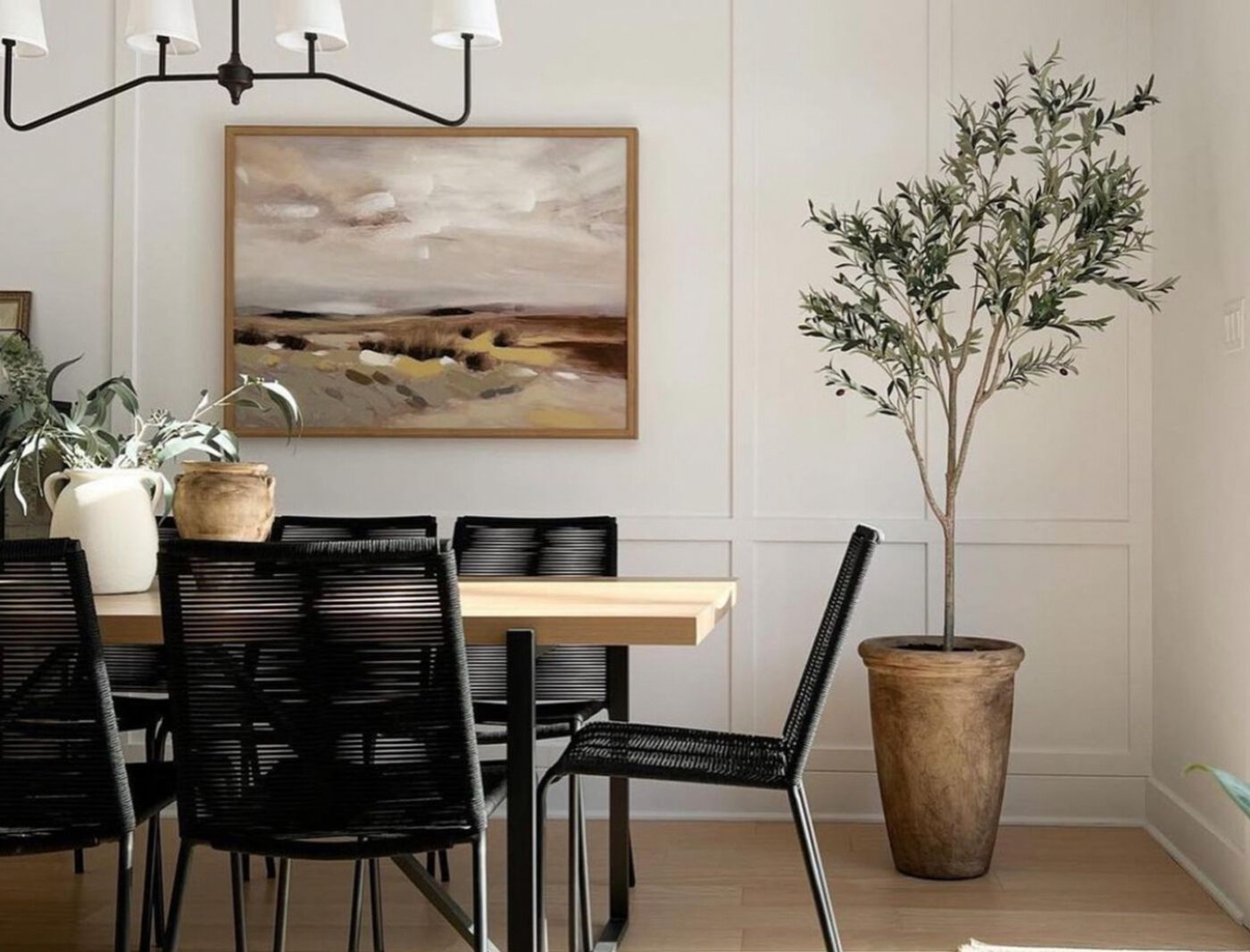 dining area image with table, chairs and olive tree